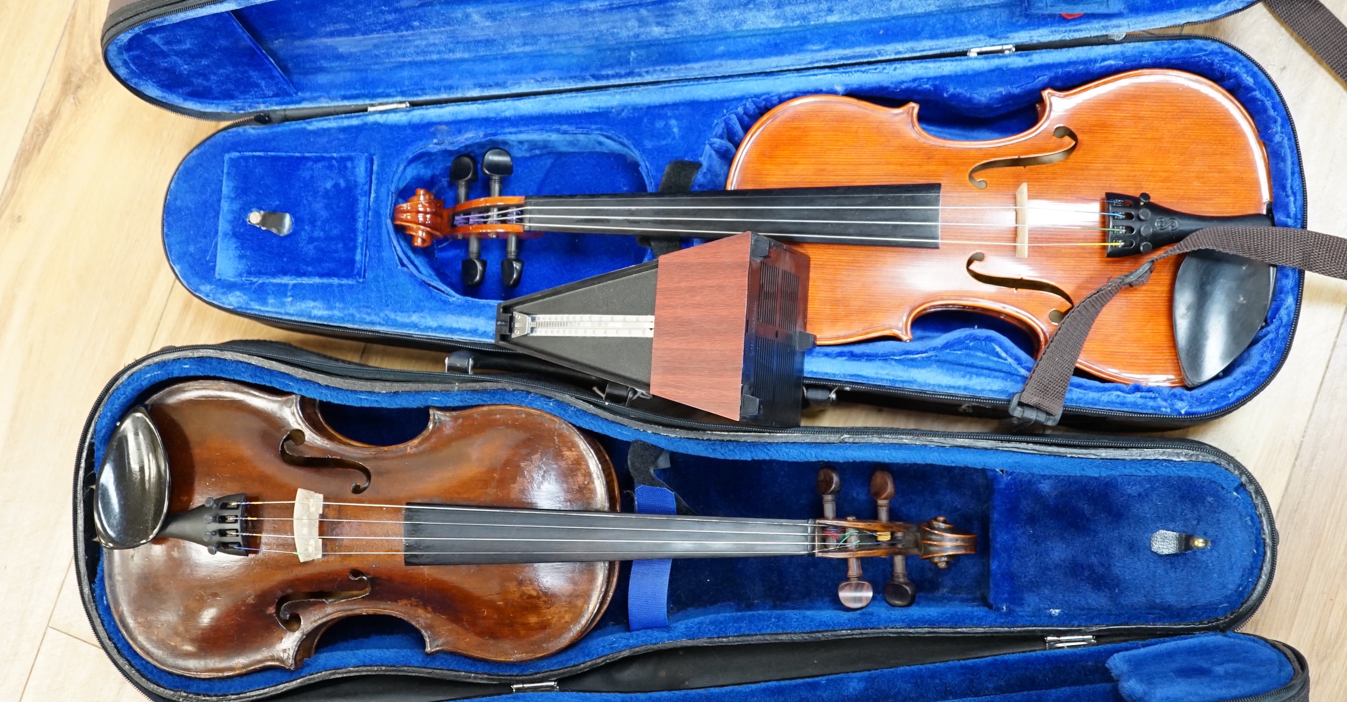 A 19th century English violin, bears hand written paper label, a modern Stentor violin and a metronome